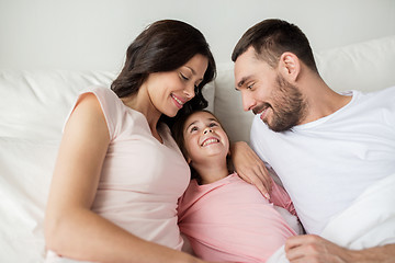 Image showing happy family in bed at home