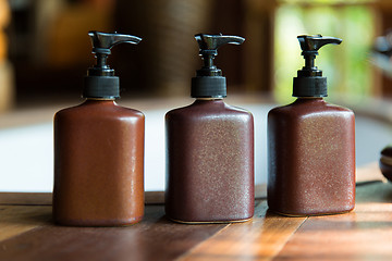 Image showing bottles with liquid soap or lotion at bathroom