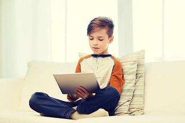 Image showing boy with tablet computer at home