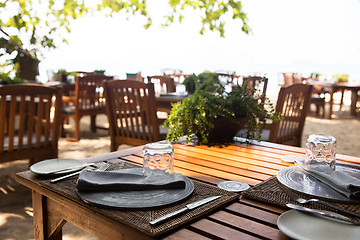 Image showing served table at open-air restaurant on beach