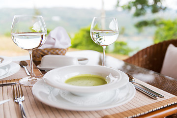 Image showing plate of cream soup at restaurant