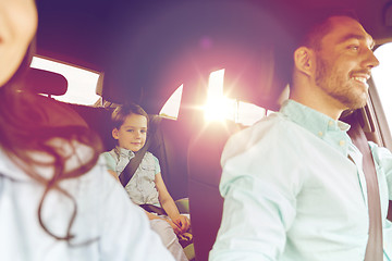 Image showing happy family with little child driving in car