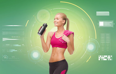 Image showing sporty woman with bottle of water and towel