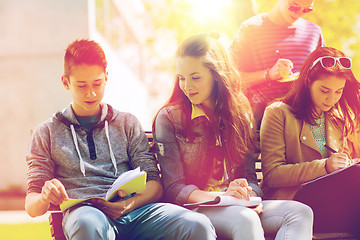 Image showing group of students with notebooks at school yard