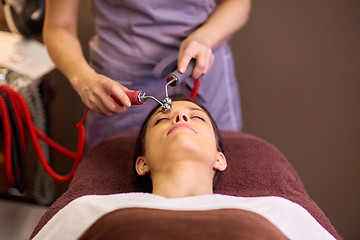 Image showing woman having hydradermie facial treatment in spa