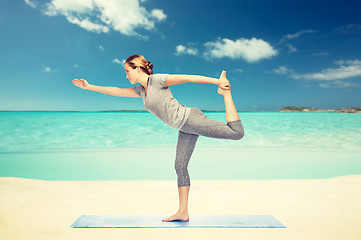 Image showing woman making yoga in lord of the dance pose 