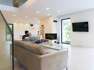 Image showing young happy couple relaxes in the living room