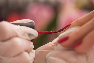 Image showing Woman hands receiving a manicure