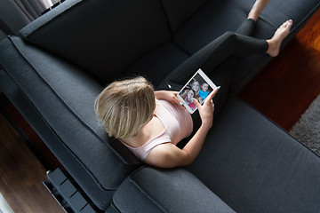 Image showing woman using tablet in beautiful apartment