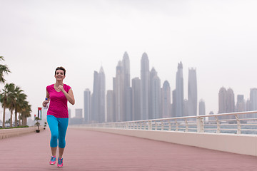 Image showing woman running on the promenade