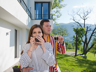 Image showing Young beautiful couple in bathrobes