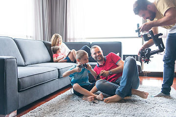 Image showing Happy family playing a video game