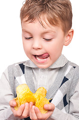 Image showing Little boy with packet potato chips