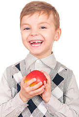 Image showing Boy with fresh red apple