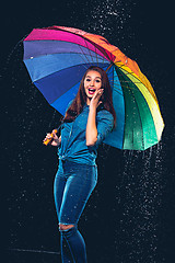 Image showing Young beautiful woman with an umbrella.