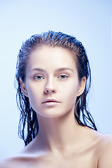 Image showing Beautiful woman face portrait close up on blue