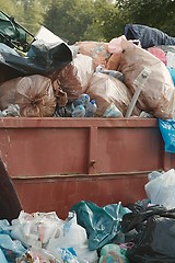 Image showing Garbage Containers Full, Overflowing