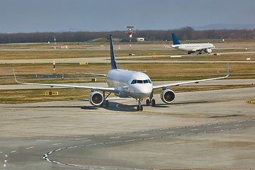 Image showing Airliner at an airport taxiway