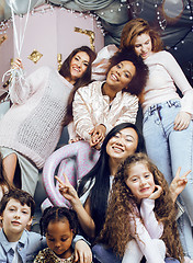 Image showing Lifestyle and people concept: young pretty diversity nations woman with different age children celebrating on birth day party together happy smiling, making selfie. African-american, asian and caucasi