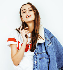 Image showing young pretty teenage hipster girl posing emotional happy smiling on white background, lifestyle people concept 