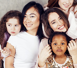 Image showing Lifestyle and people concept: young pretty diversity nations woman with different age children celebrating on birth day party together happy smiling, making selfie. African-american, asian and caucasi