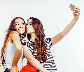 Image showing best friends teenage girls together having fun, posing emotional on white background, besties happy smiling, lifestyle people concept close up