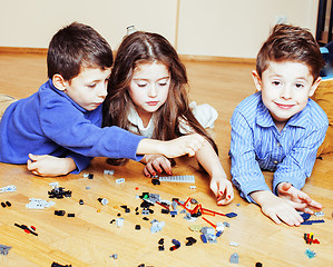 Image showing funny cute children playing toys at home, boys happy smiling, first education role lifestyle 