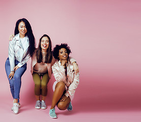 Image showing different nation girls with diversuty in skin, hair. Asian, scandinavian, african american cheerful emotional posing on pink background, woman day celebration, lifestyle people concept