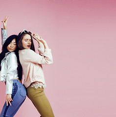 Image showing different nation girls with diversuty in skin, hair. Asian, scandinavian, african american cheerful emotional posing on pink background, woman day celebration, lifestyle people concept 