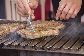 Image showing Grilled meat steak on the grill