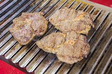 Image showing Grilled meat steak on the grill