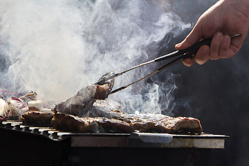 Image showing Grilled pork ribs and red chicory on the grill