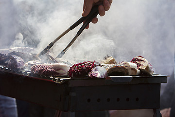 Image showing Grilled pork ribs and red chicory on the grill