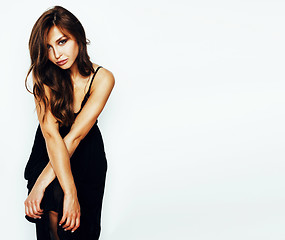 Image showing young brunette pretty woman in black dress posing on white background, copyspace for text close up