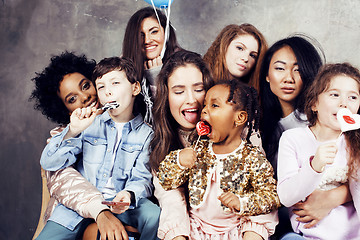 Image showing Lifestyle and people concept: young pretty diversity nations woman with different age children celebrating on birth day party together happy smiling, making selfie. African-american, asian and caucasi