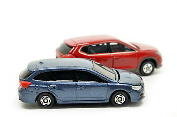 Image showing Small blue and red toy cars 