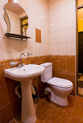 Image showing Bathroom in the hotel, washbasin, mirror and toilet