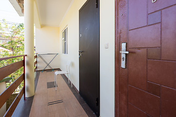 Image showing Old and new door in the room, on the second floor of the hotel