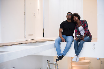 Image showing couple having break during moving to new house