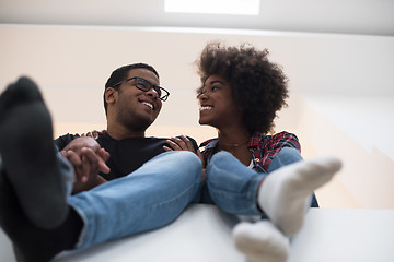 Image showing couple having break during moving to new house