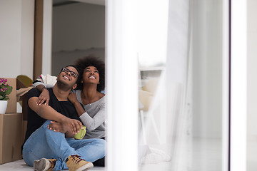 Image showing African American couple relaxing in new house