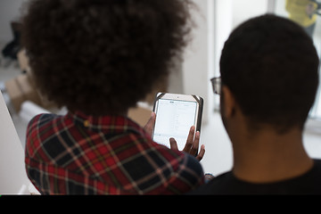 Image showing african american couple using tablet at home