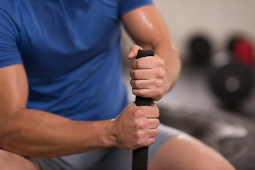 Image showing young man after workout with hammer and tractor tire