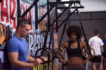 Image showing Portrait of multiethnic couple  after workout at gym