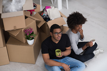 Image showing African American couple relaxing in new house