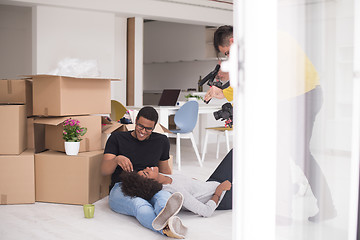 Image showing African American couple relaxing in new house