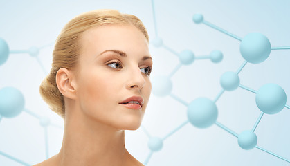 Image showing beautiful young woman face with molecules