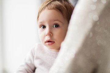 Image showing close up of sweet little baby girl with mother