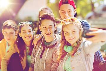 Image showing happy teenage students taking selfie by smartphone