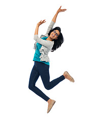 Image showing smiling young indian woman jumping in air